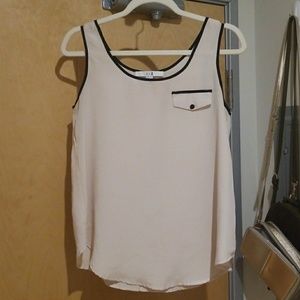 Off-white flowy top with black button pocket